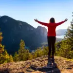 A woman lifts her eyes toward the mountains for hope in hard times.