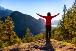 A woman lifts her eyes toward the mountains for hope in hard times.