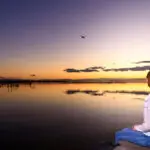 A woman sits quietly, enjoying the peace in the stillness.