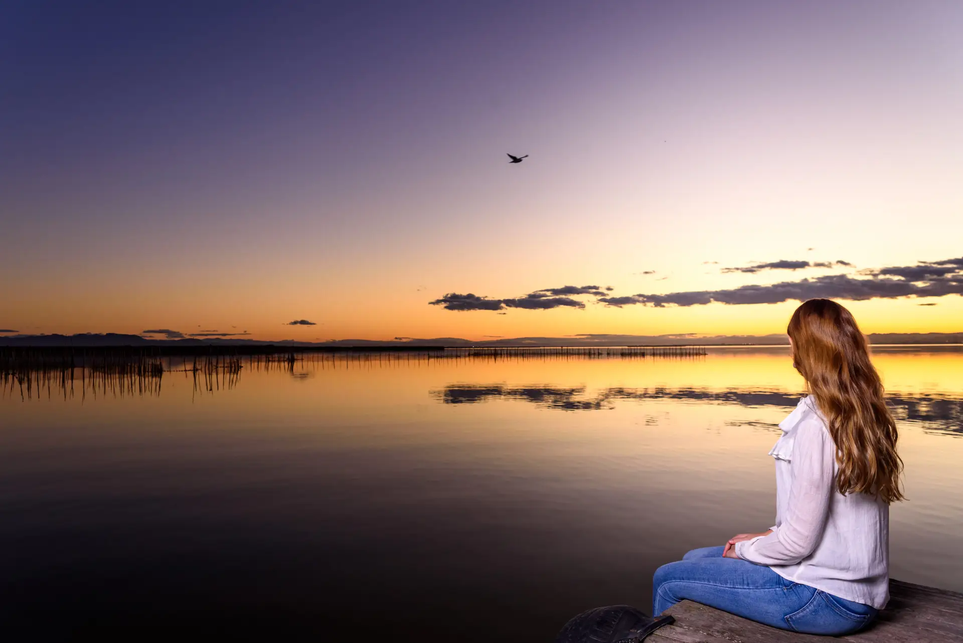 There is peace in the stillness of a beautiful lake at sunset.
